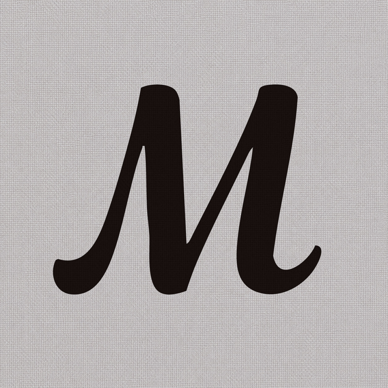 Temporary tattoo design featuring a bold black uppercase letter M in a clean minimal style.