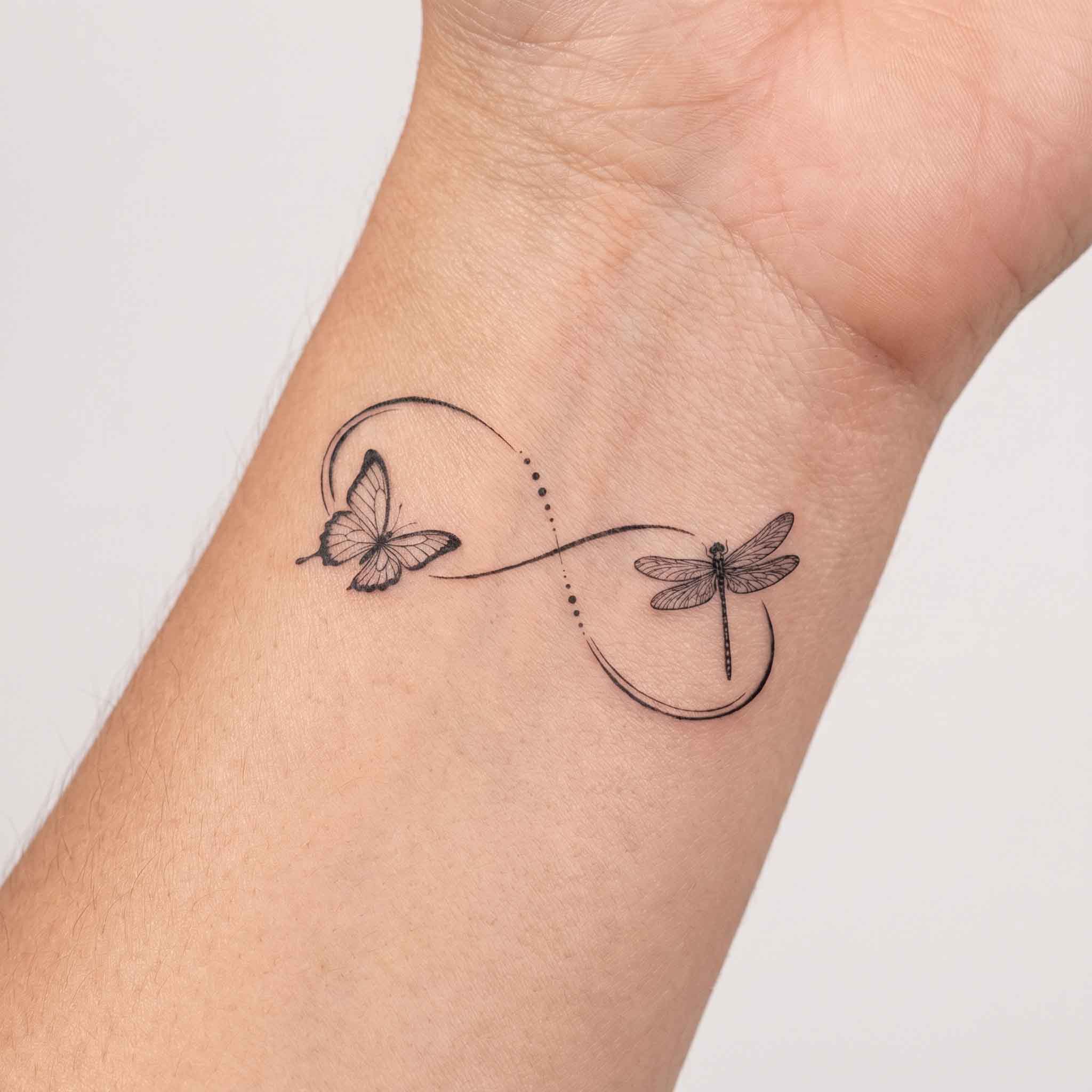 Butterfly and dragonfly infinity temporary tattoo on inner wrist