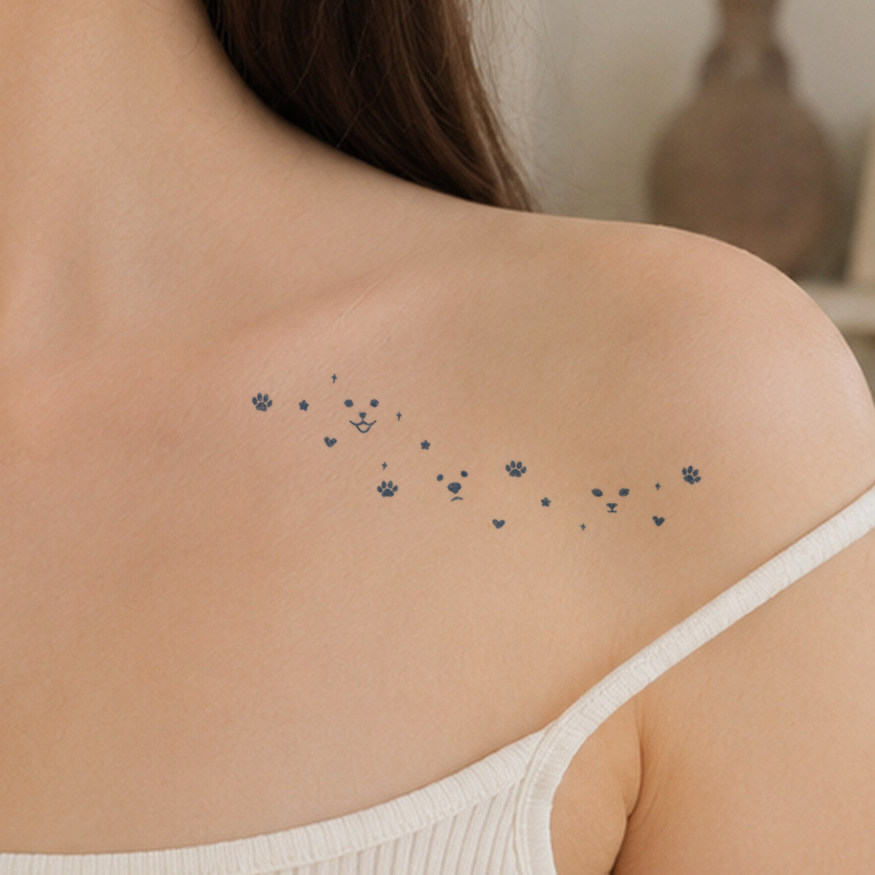 Temporary shoulder tattoos featuring three cartoon pet faces, paw prints, hearts, and tiny star details.