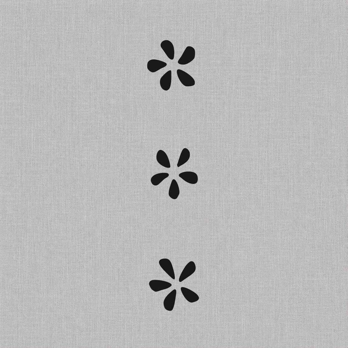 Minimalist temporary tattoos featuring simple five-petal flower silhouettes
