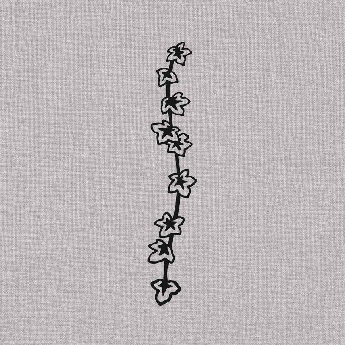 Minimalist flower temporary tattoos featuring a vertical vine with delicate blooming flowers
