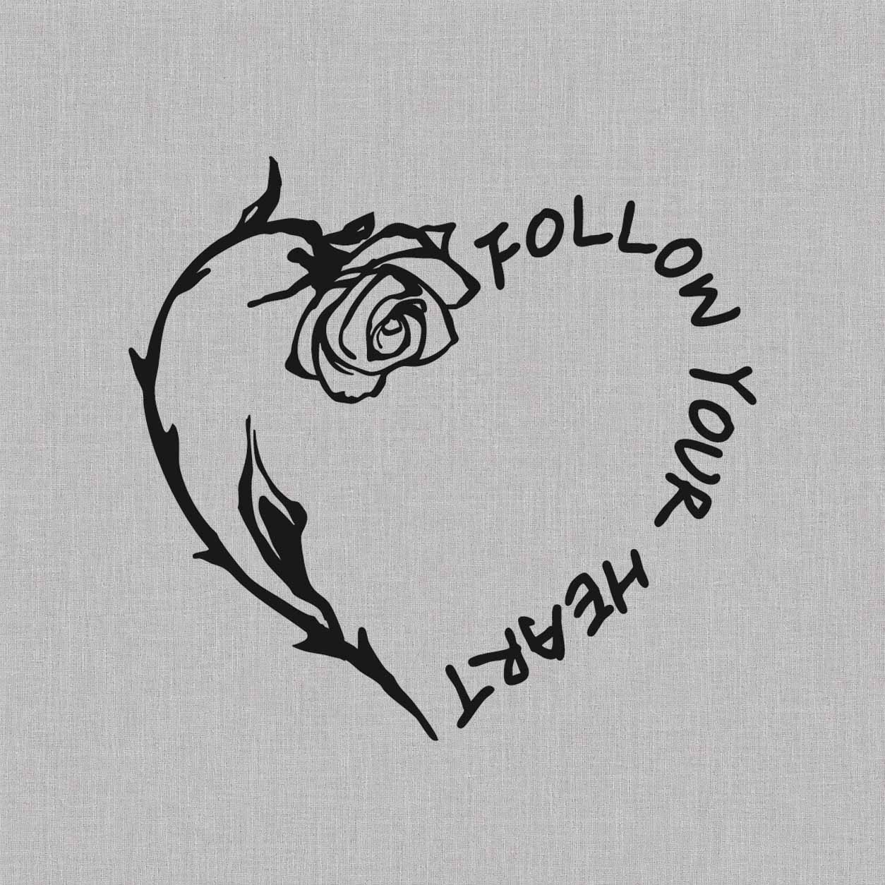 Follow Your Heart rose semi-permanent tattoo featuring circular lettering, a blooming rose, and a curved thorny stem forming a heart shape.
