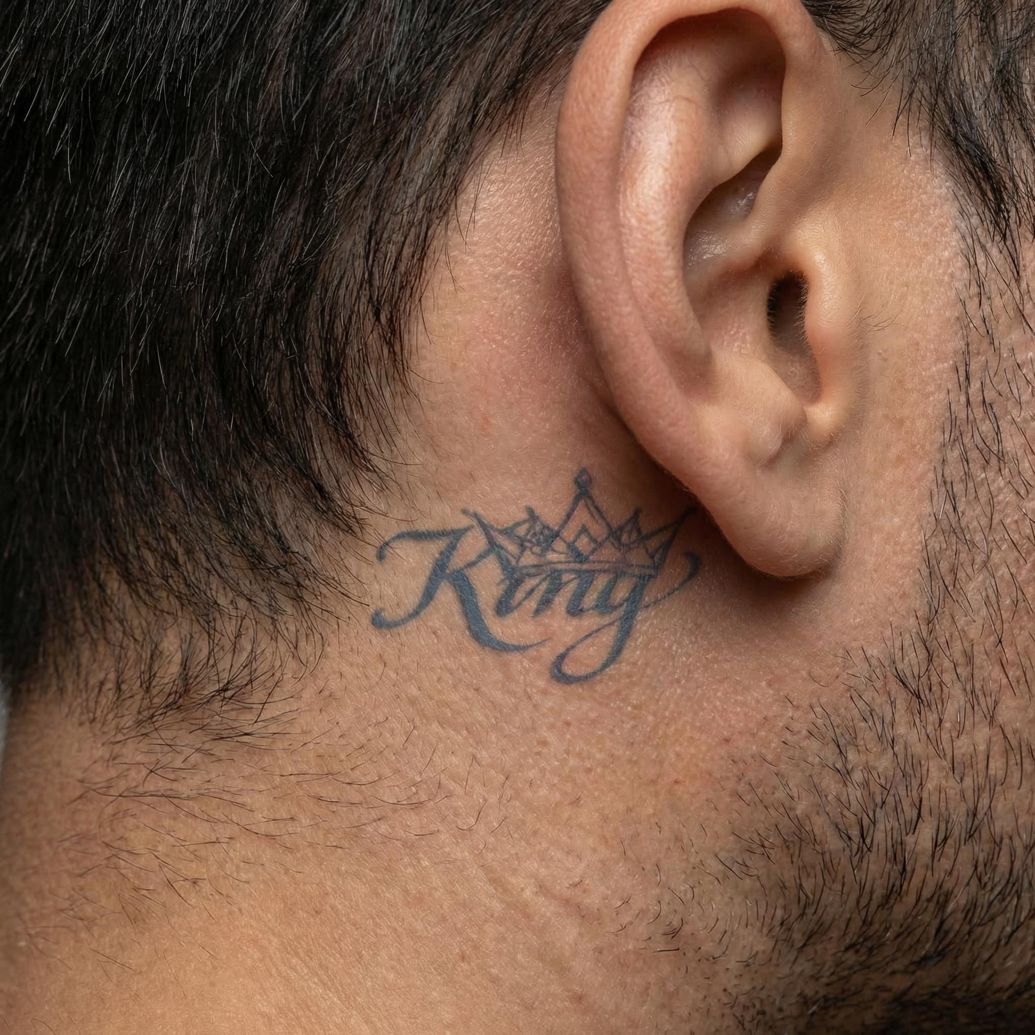 King temp tattoos behind the ear with romantic script details