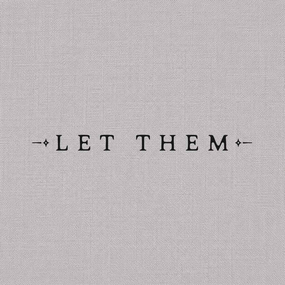Temporary tattoo featuring the words “LET THEM” in uppercase lettering with thin horizontal lines and small diamond-shaped accents.