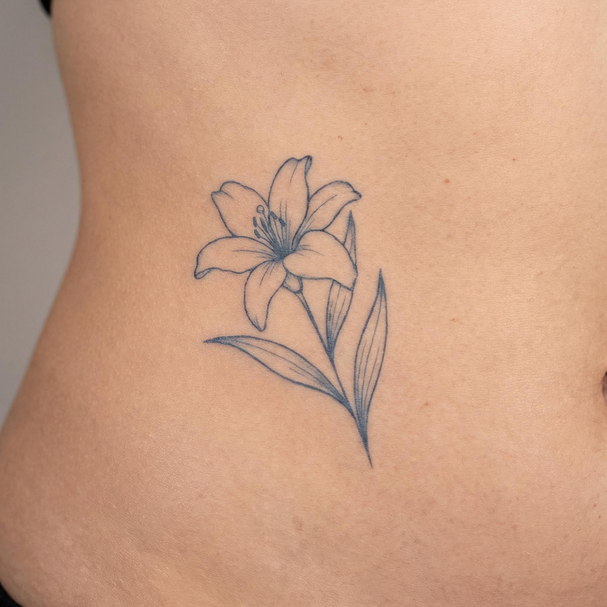 Lily floral temp tattoo worn on skin 
