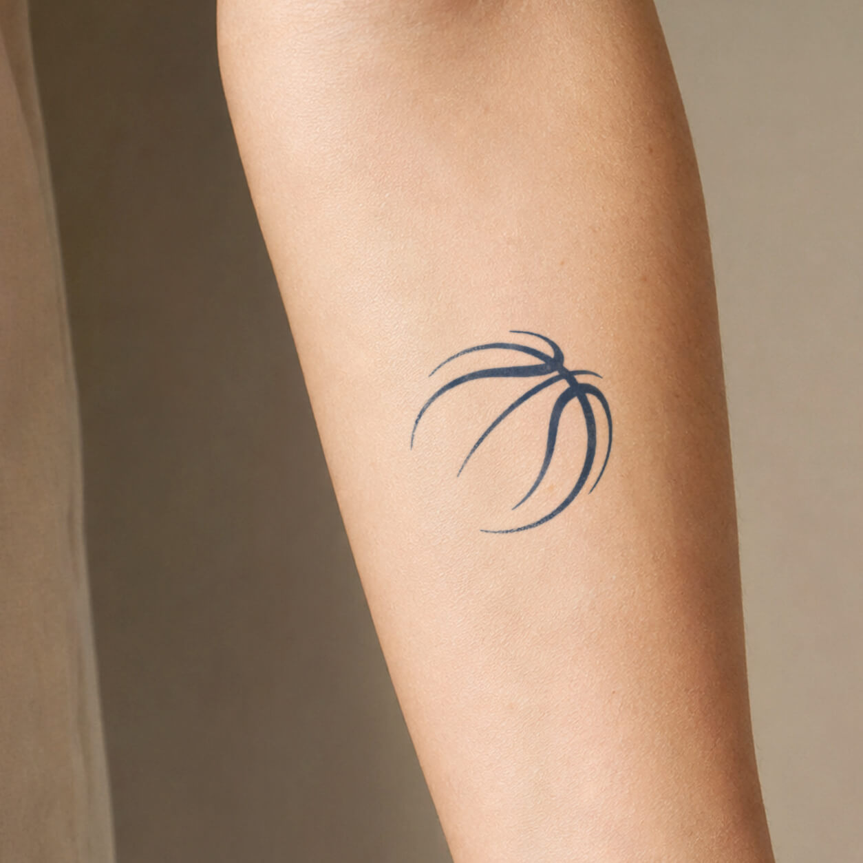 Simple fine line tattoo featuring an abstract basketball outline with curved motion lines. This minimalist temporary tattoo design captures a sporty and modern style with clean strokes and a subtle athletic feel.
