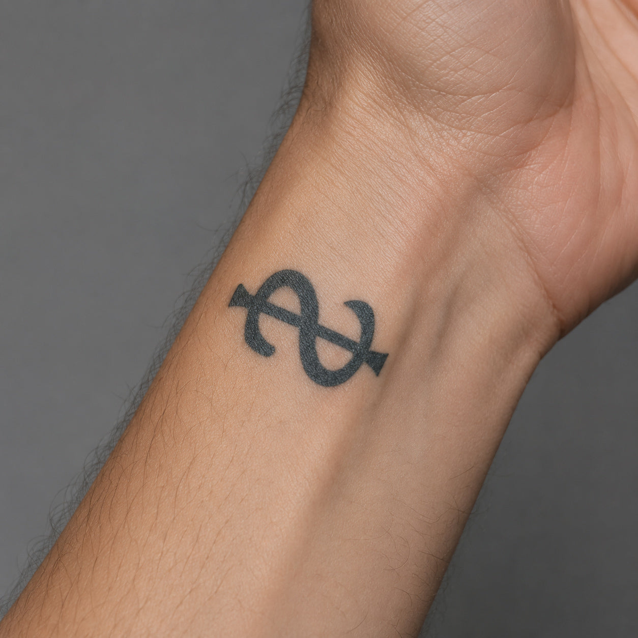 Simple dollar sign tattoo placed on the inner wrist, featuring a bold and meaningful symbol temporary tattoo design.