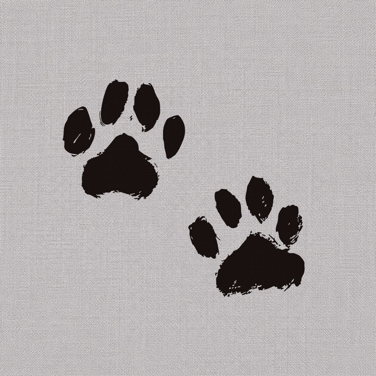 Temporary tattoo designs featuring two bold black paw prints with a soft hand-stamped look.