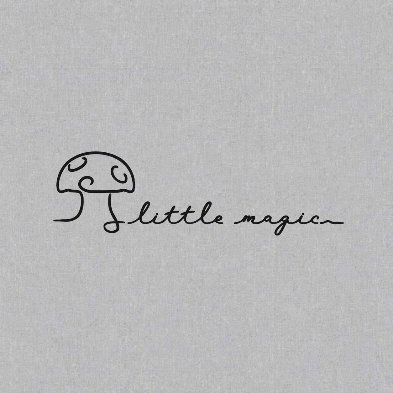 Little Magic temporary tattoo featuring a minimalist mushroom and flowing handwritten script in continuous black linework.
