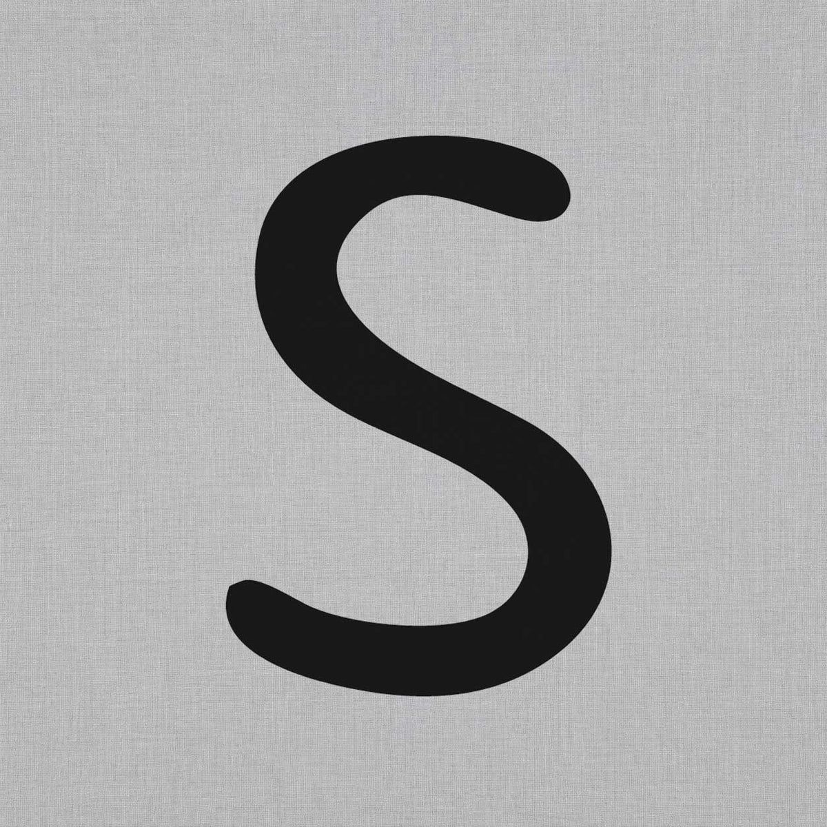 Letter_S_temporary_tattoo_featuring_a_bold_minimalist_initial_design.