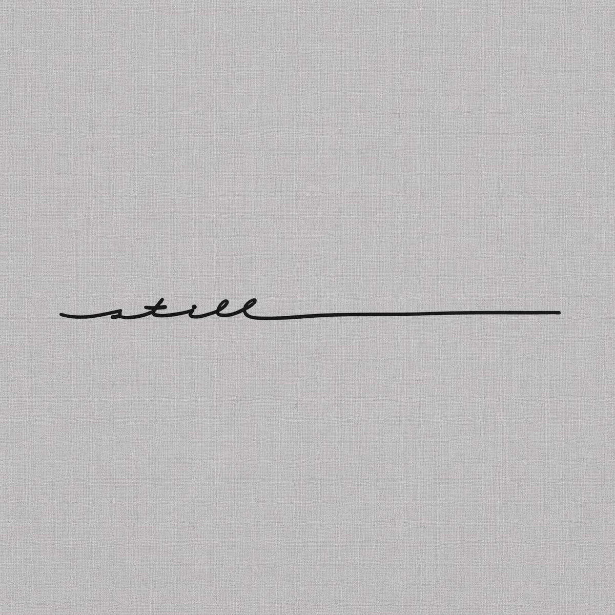 Minimalist script temporary tattoo featuring a thin handwritten line design.
