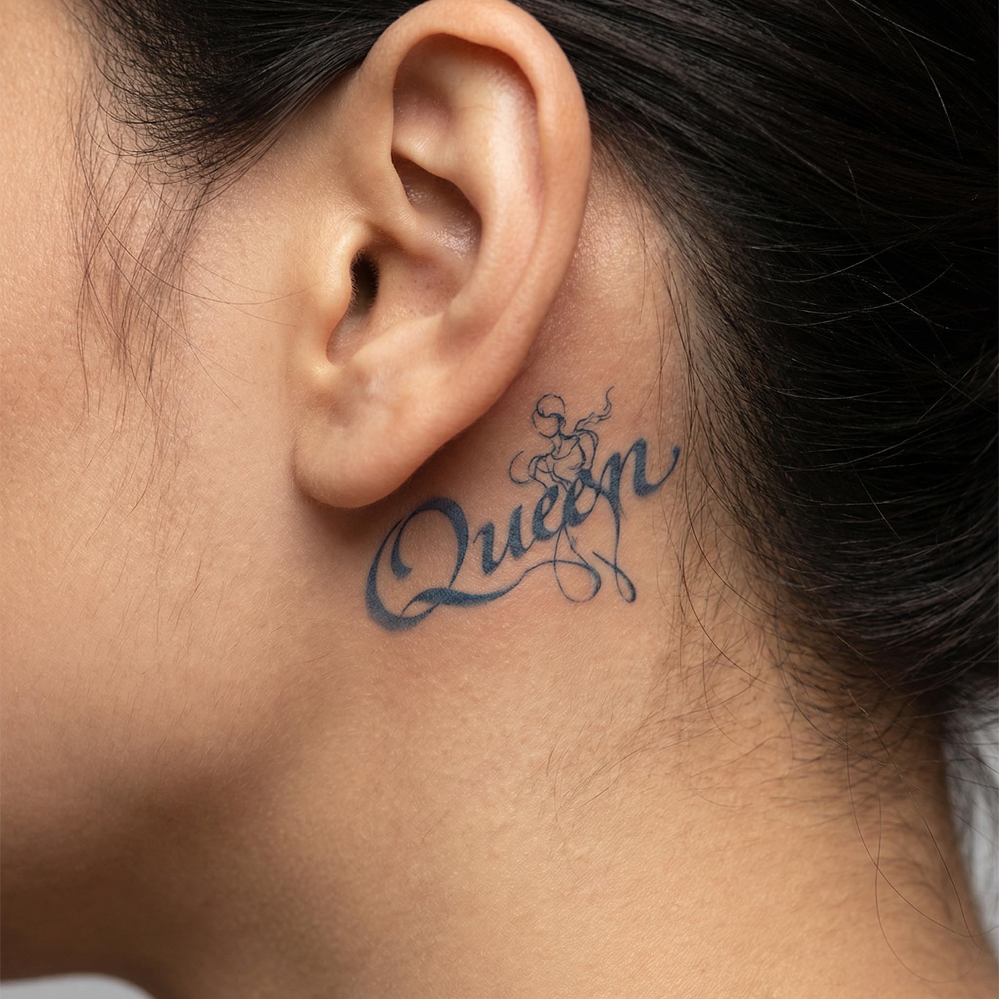 Queen temp tattoos behind the ear with romantic script details