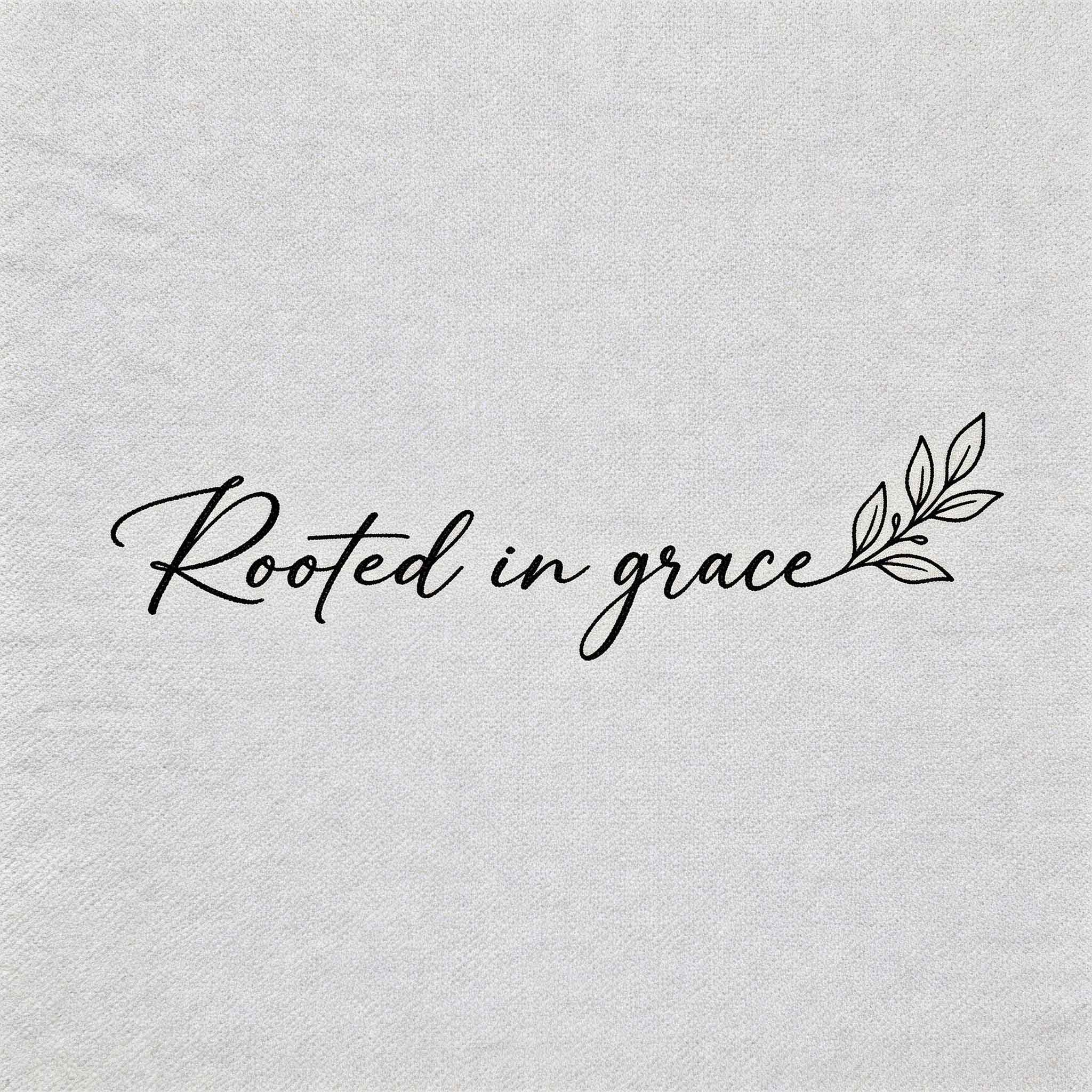 "Rooted in Grace" quote temporary tattoo with minimalist script and leaf detail