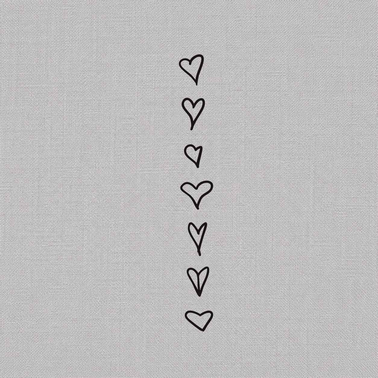 Temporary tattoo ideas design featuring seven simple hand-drawn outline hearts arranged vertically in different shapes and sizes.
