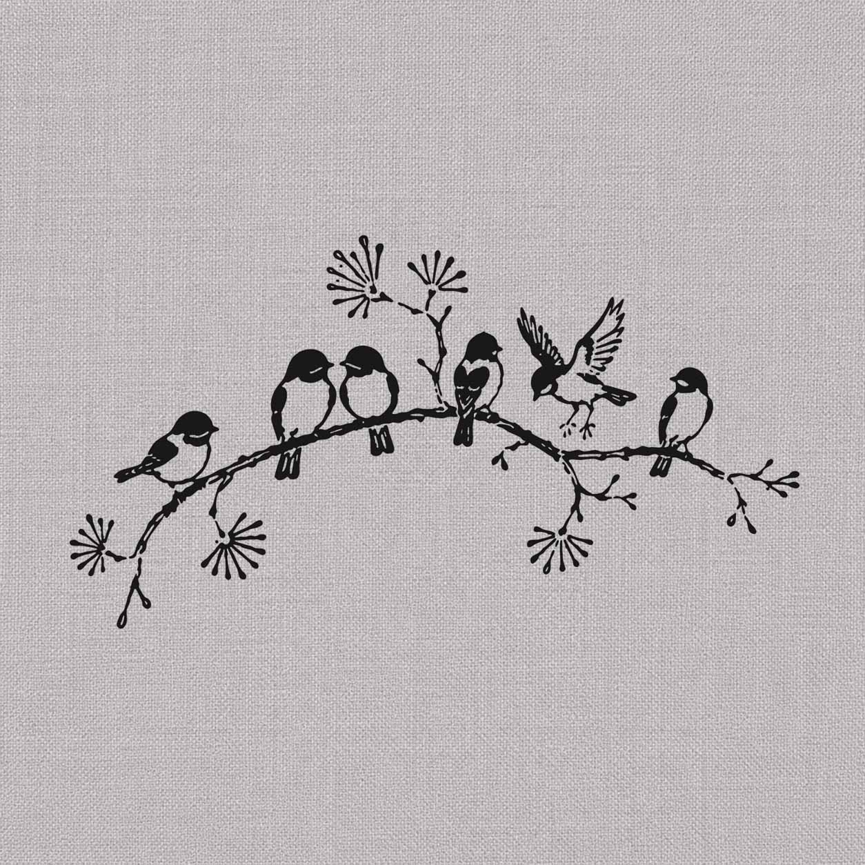 Songbird semi-permanent tattoo featuring six small birds resting and landing on a curved flowering branch.
