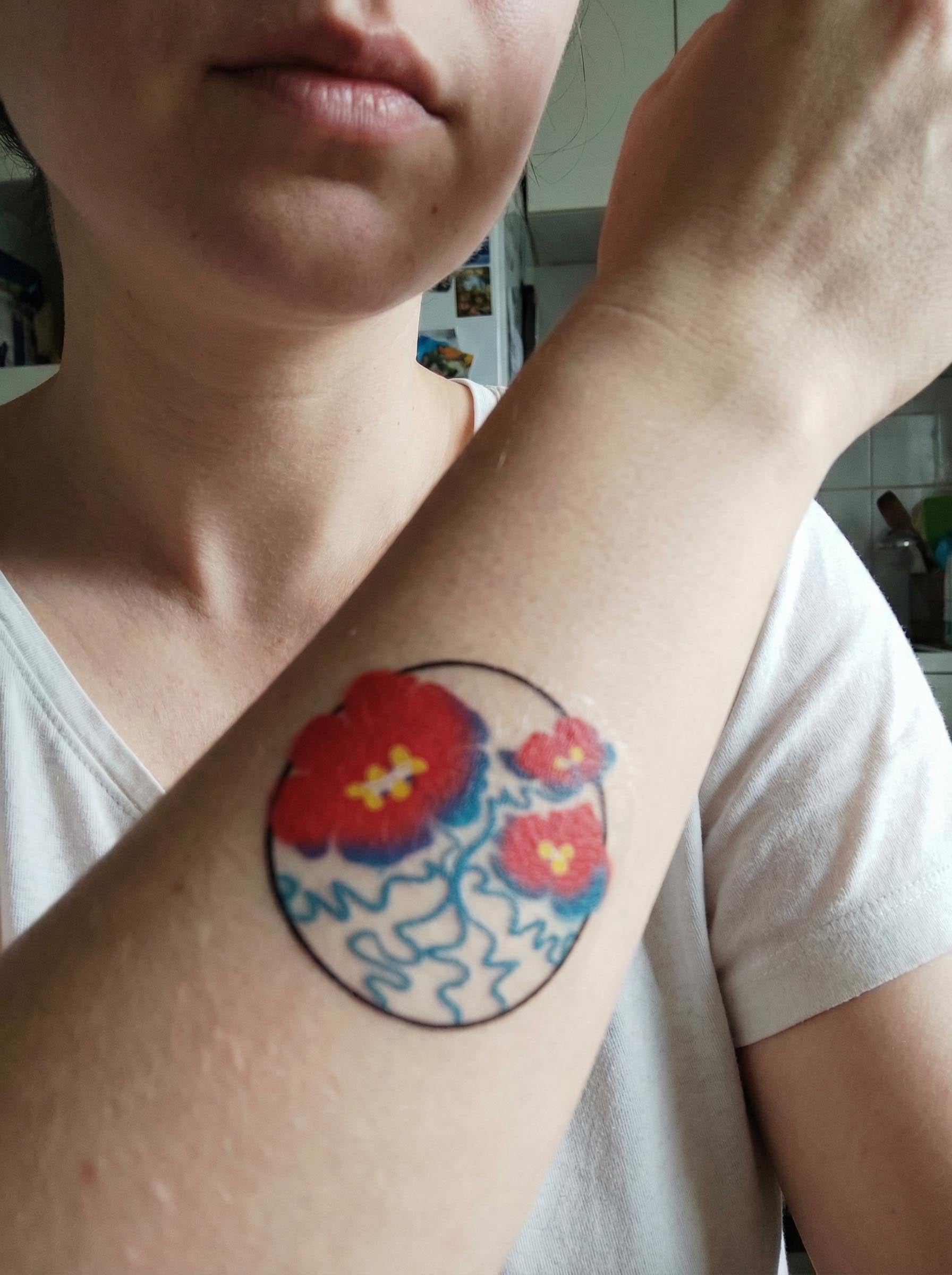 Red Flower Circle Forearm Tattoo Real Shot
