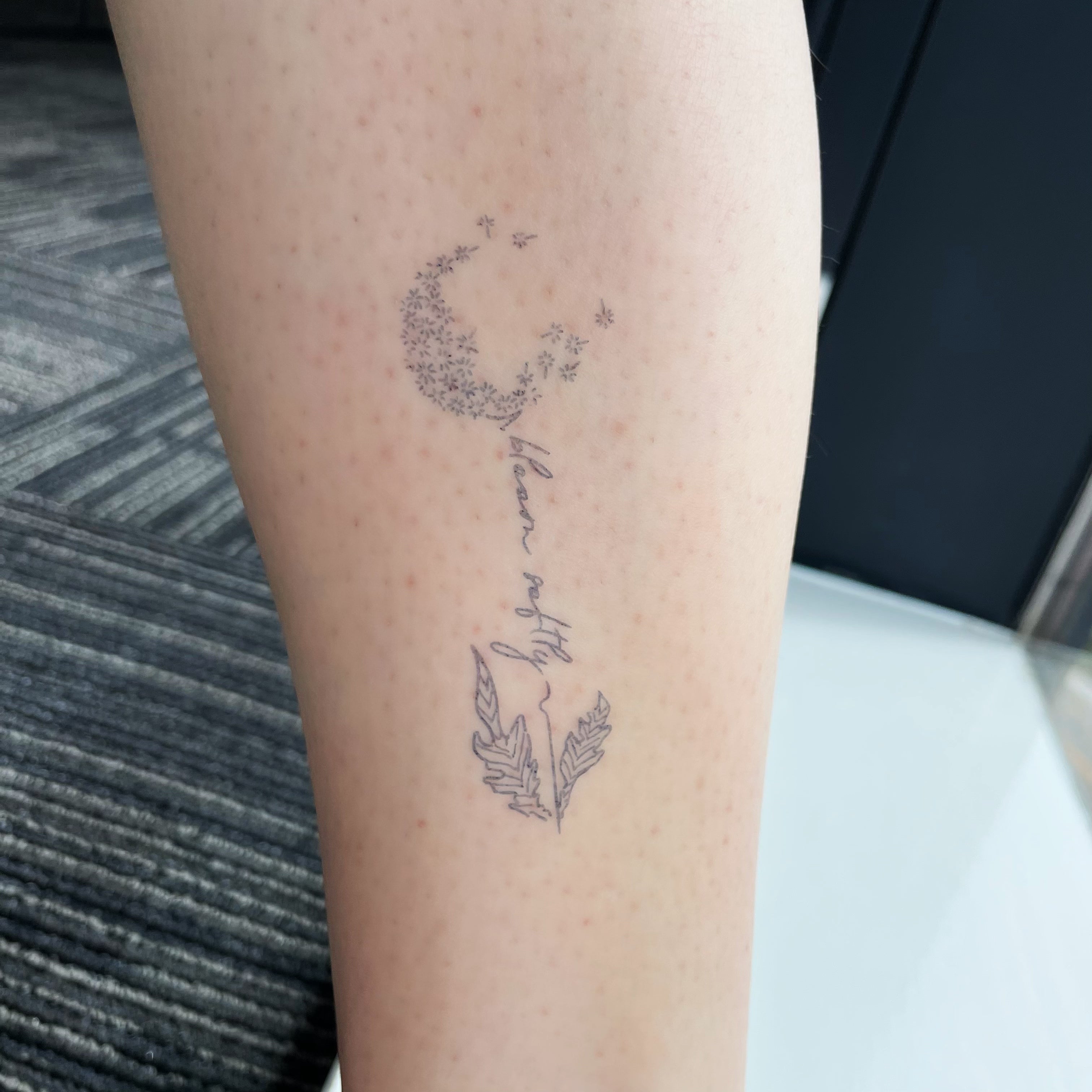 “Bloom Softly” dandelion art temporary tattoos shown on skin.