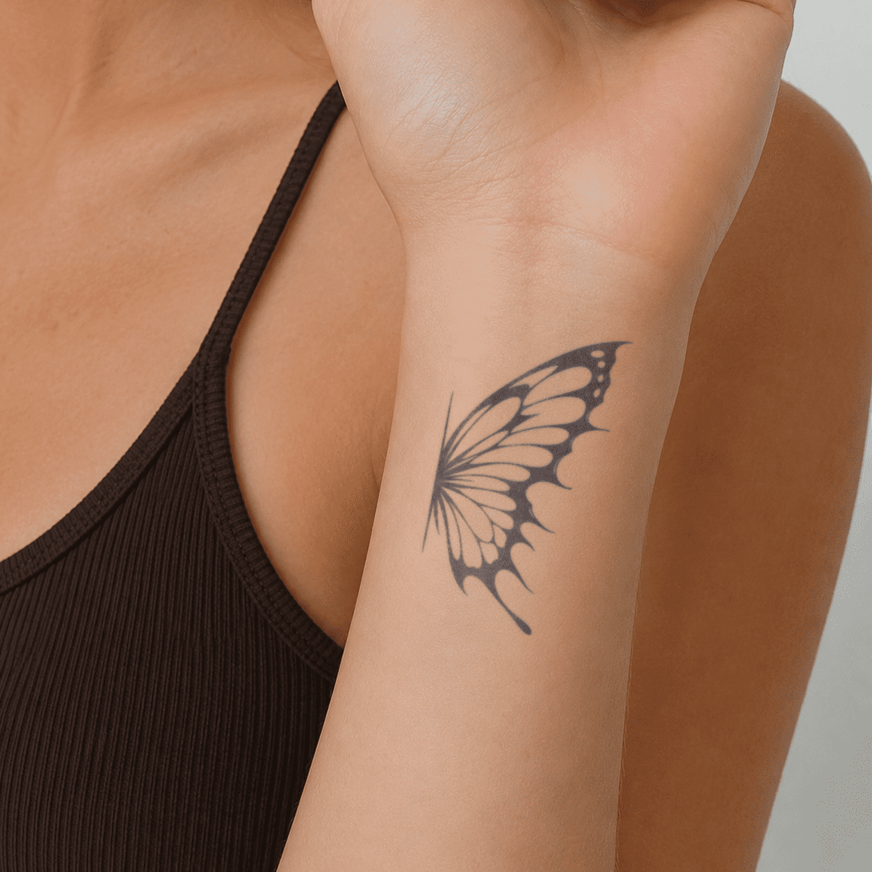 butterfly temporary tattoo with delicate wing design on wrist