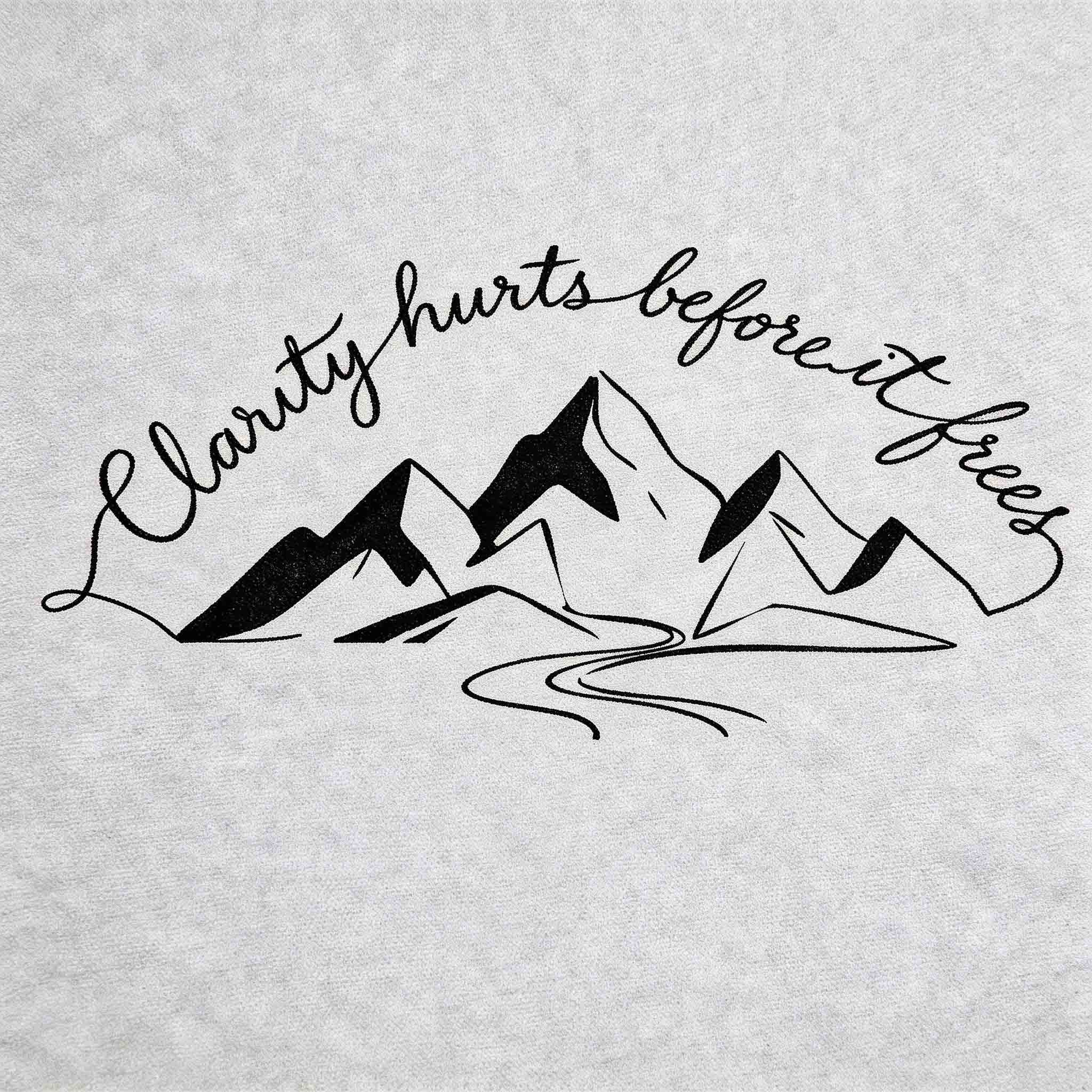 Herbal semi-permanent temporary tattoo with mountain design and “Clarity hurts before it frees” quote