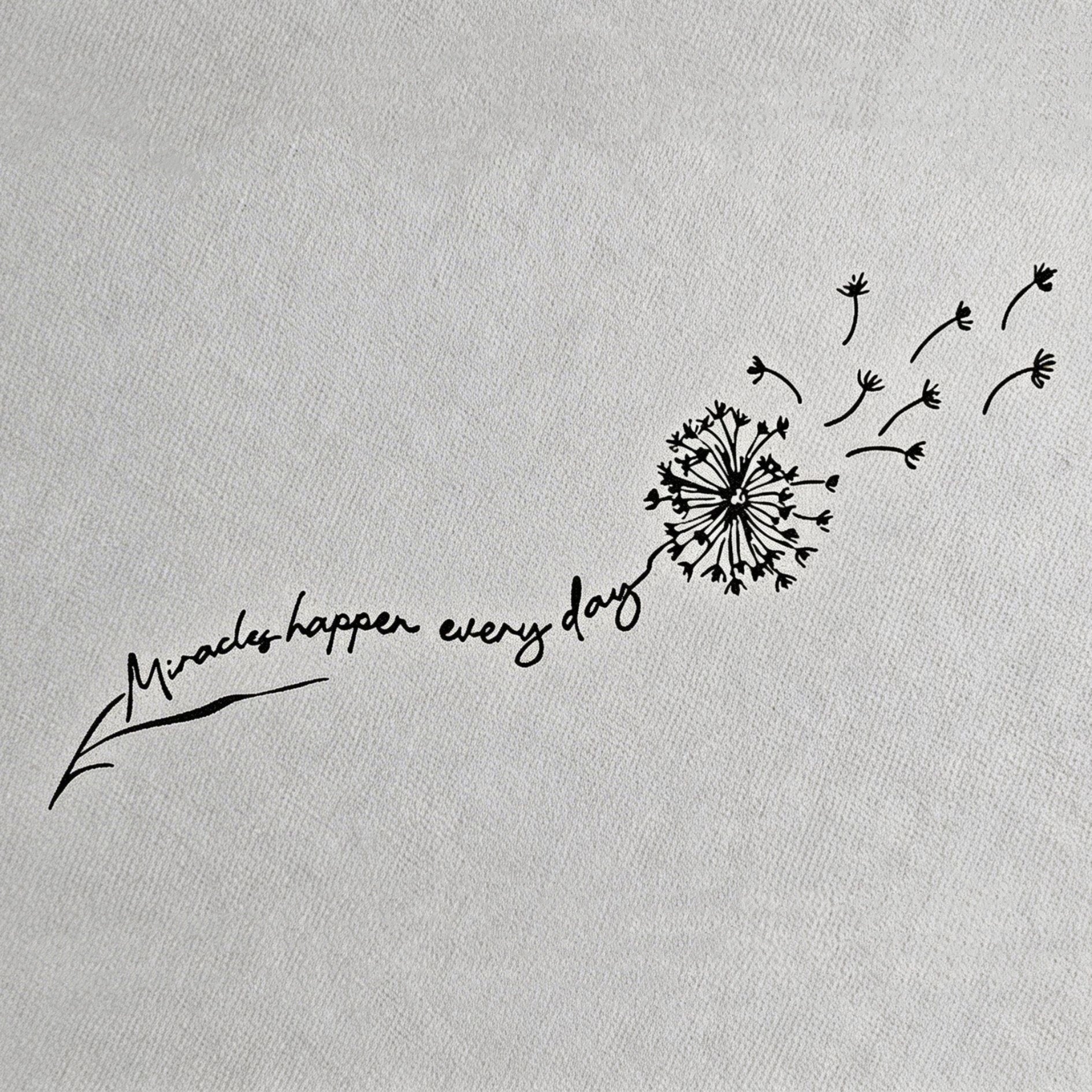 Dandelion temporary tattoo with “Miracles happen every day” script stem