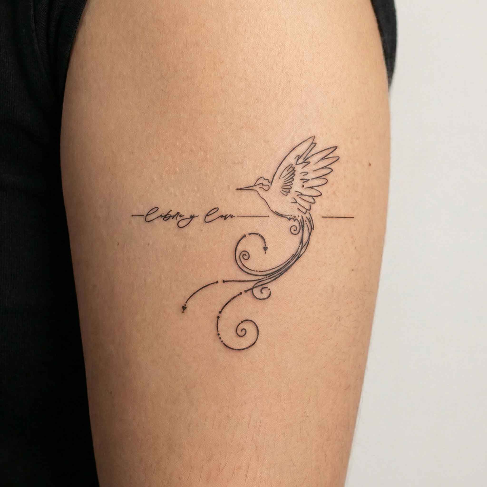 Hummingbird temporary arm tattoos shown on skin.