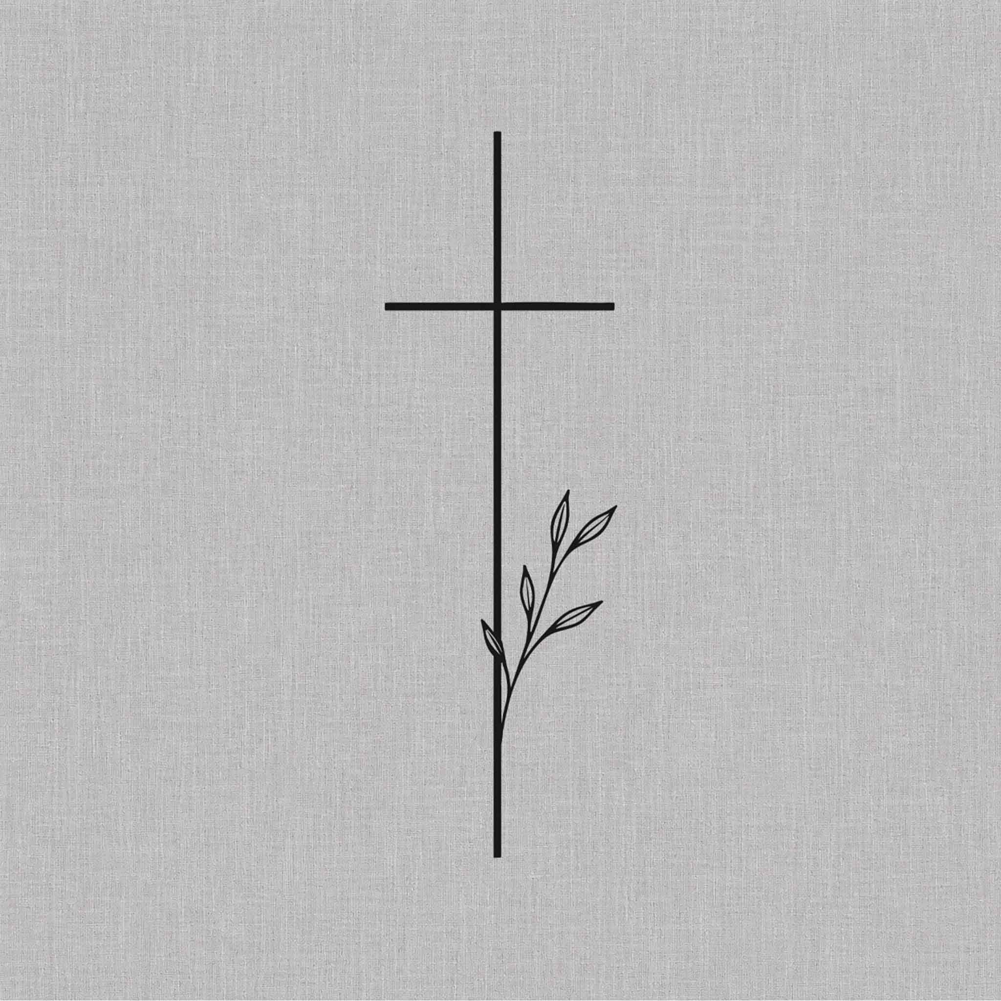 minimalist cross temporary tattoo with leaf branch design
