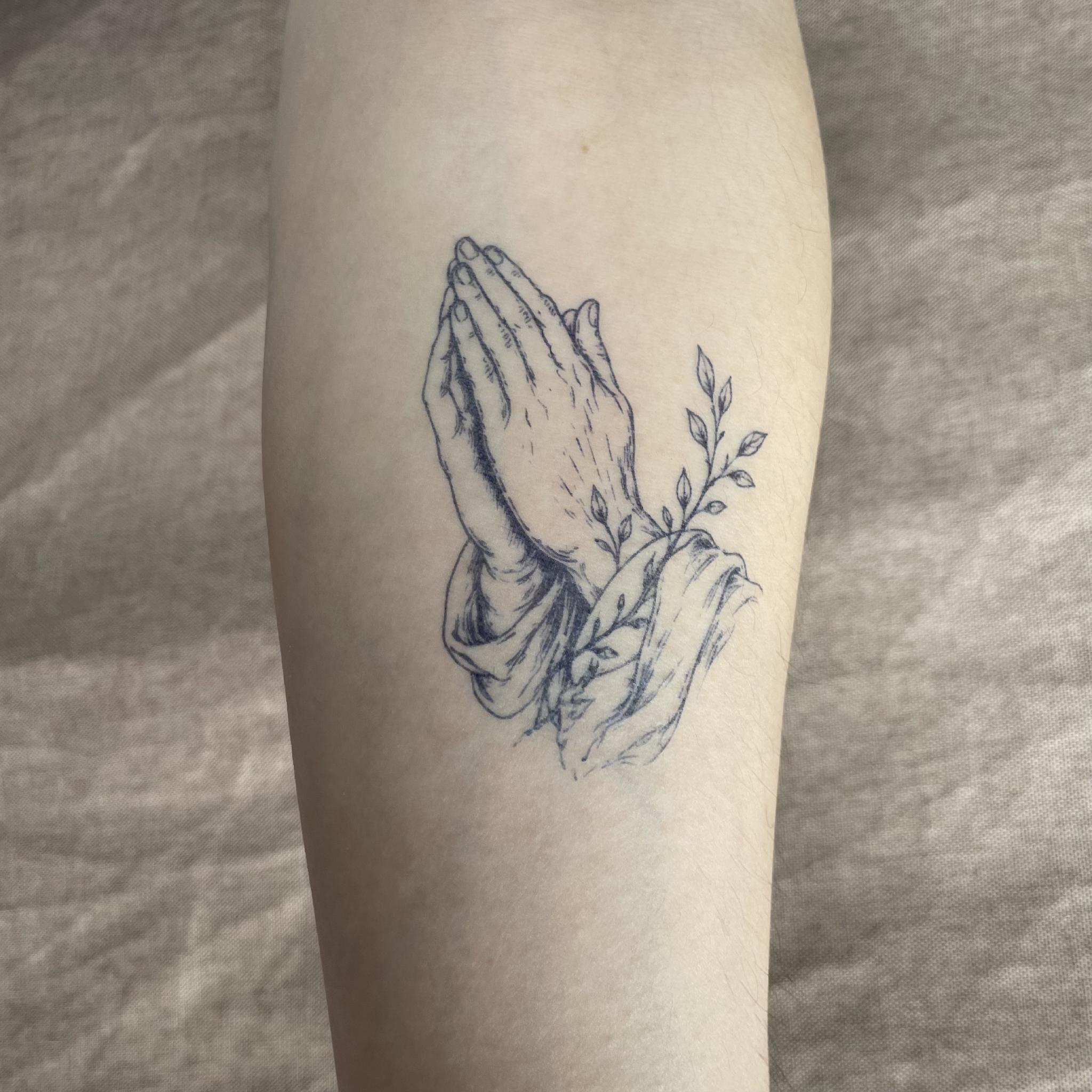 praying hands minimalist temporary tattoo on arm