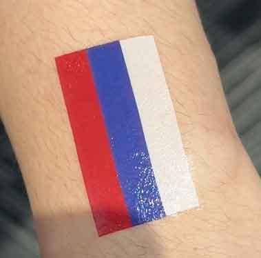 Russia flag heart temporary tattoo worn on arm for football game day and fan outfit look