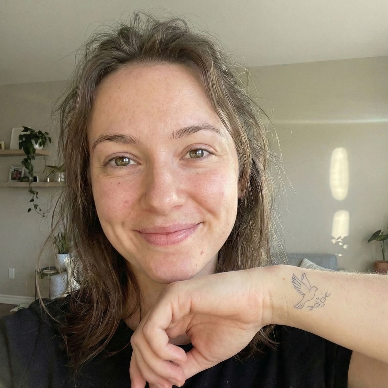 small bird temporary tattoo on shoulder lifestyle close up