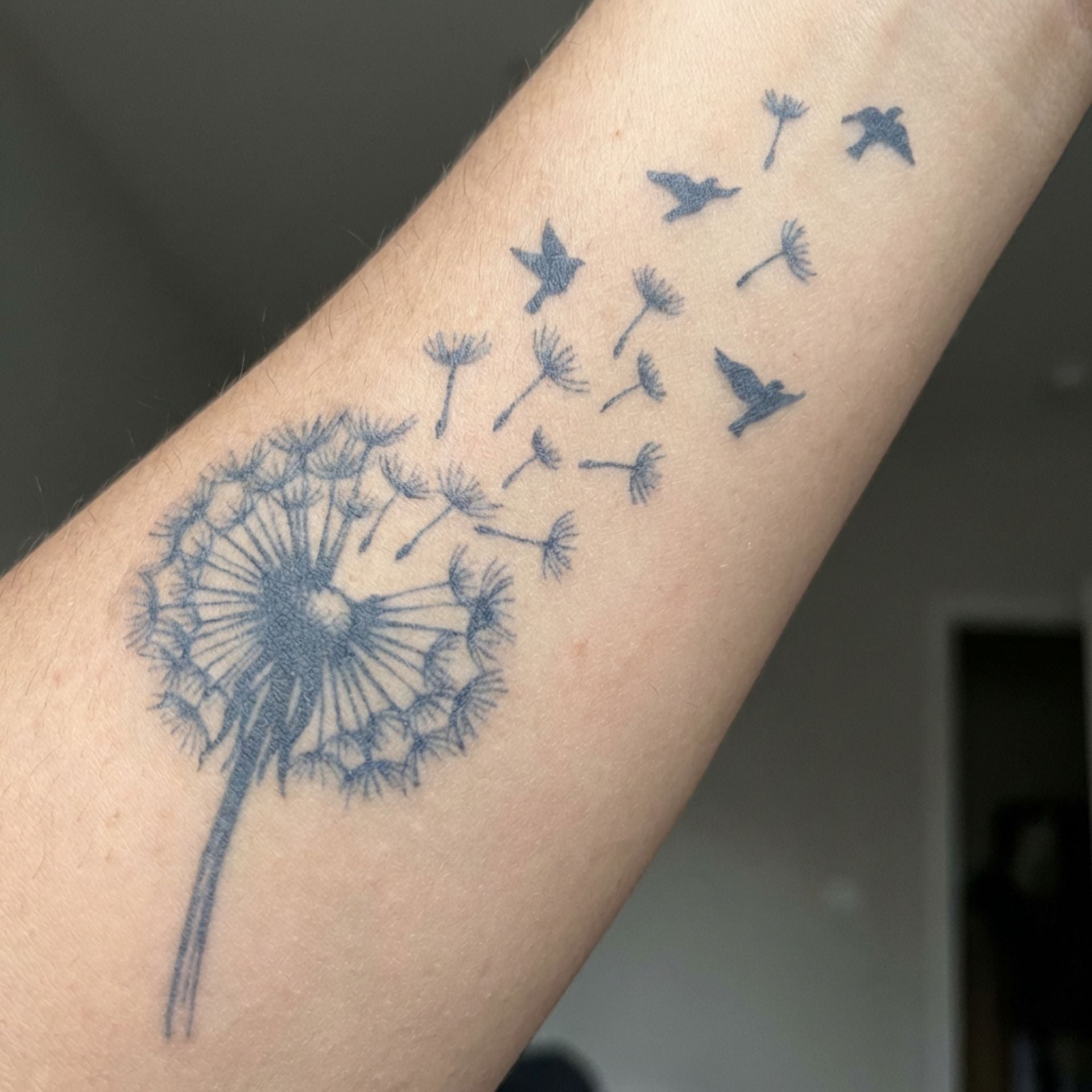 fine line quiet strength temporary tattoo on forearm