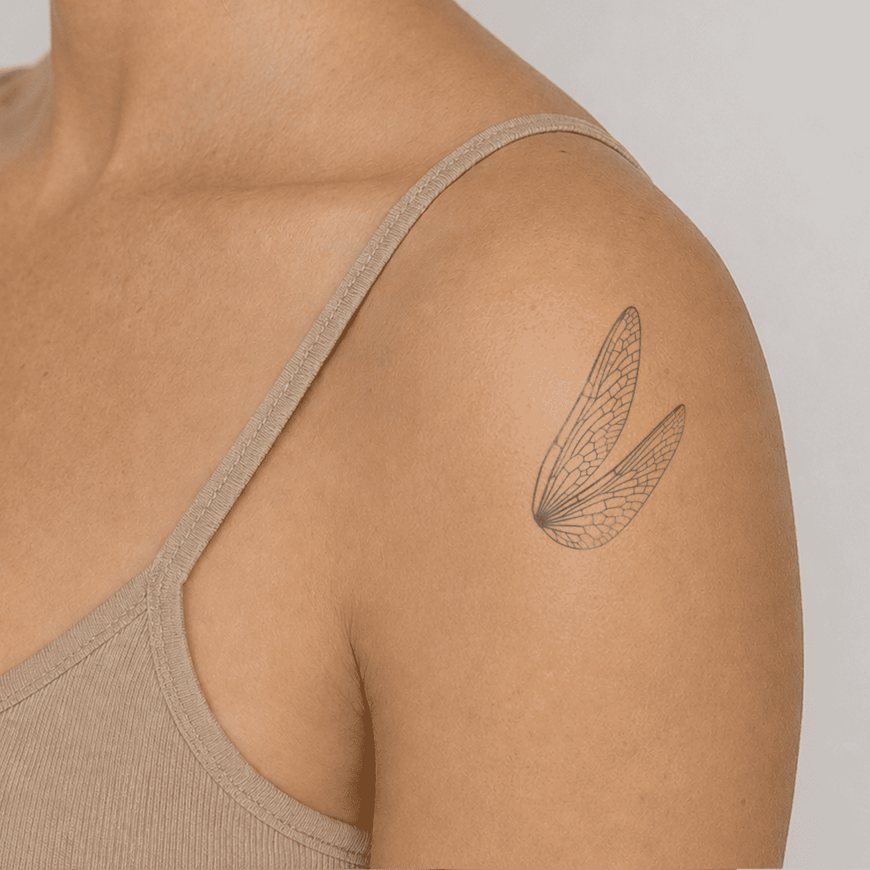 upper arm dragonfly wing temporary tattoo with delicate linework
