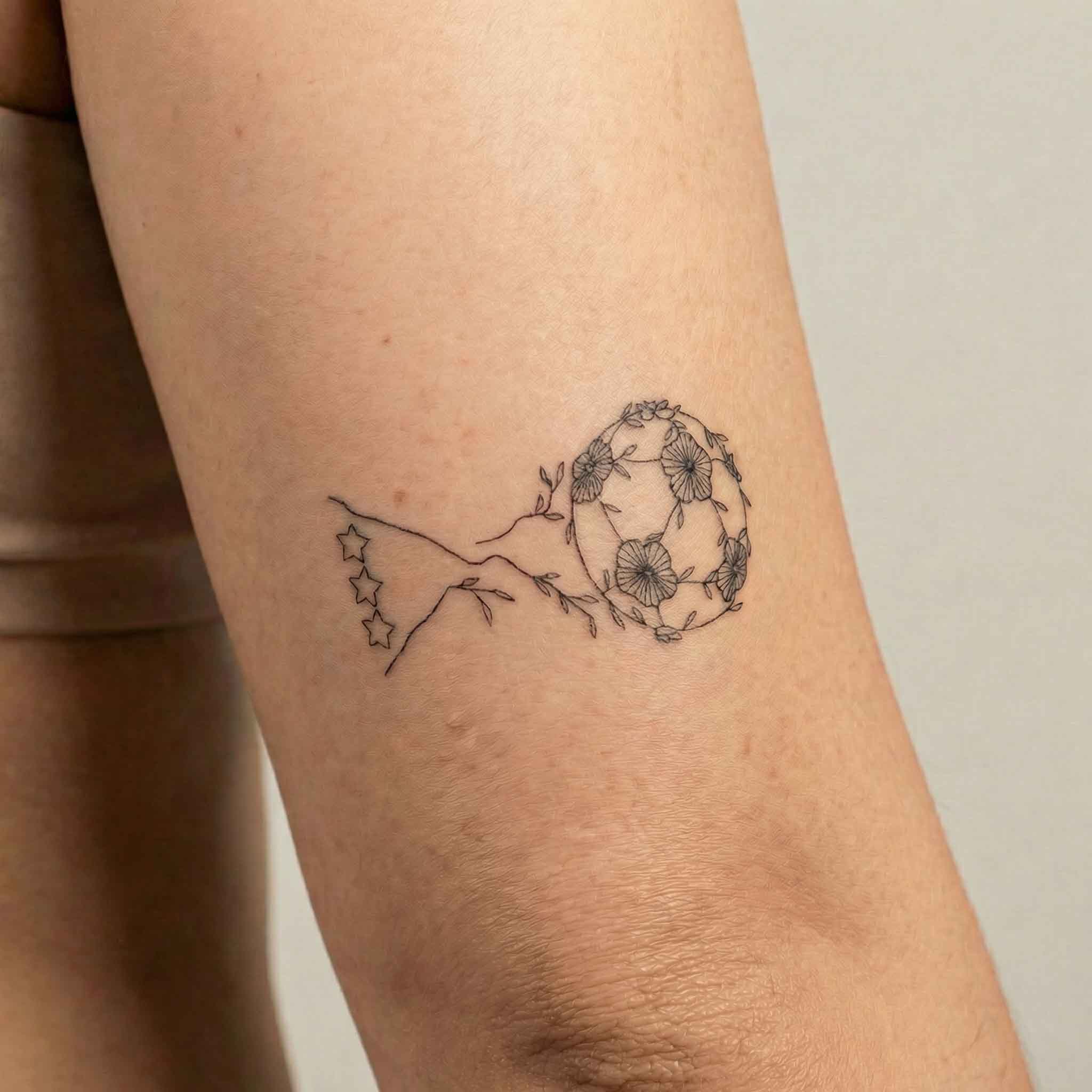 Minimalist floral trophy fake tattoo on the arm